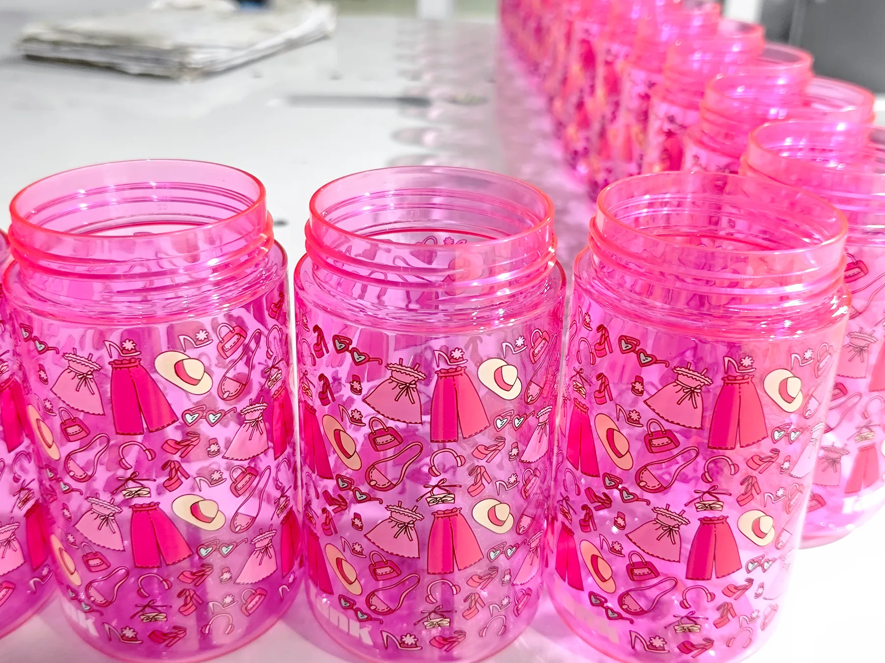 Finished cups from an automated decoration process